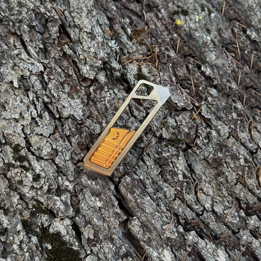 Ultra Slim Titanium Utility Tool With A Bronze Slider