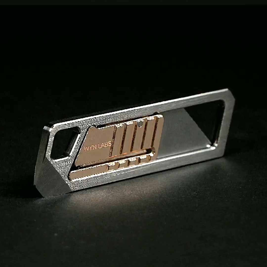 Ultra Slim Titanium Utility Tool With A Bronze Slider