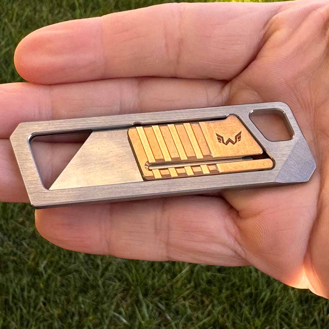 Ultra Slim Titanium Utility Tool With A Bronze Slider